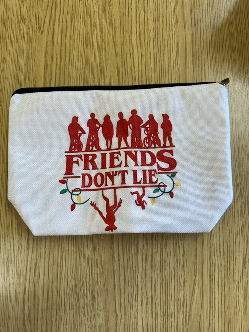 Stranger Things “Friends Don’t Lie” Canvas Pouch Bag in White with Red Graphic